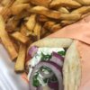 284901504_5555909381121095_5461176464386630582_n Chicken Souvlaki Pita Tender marinated chicken breast in a pita with tomato, red onion, tzatziki & parsley with fries or rice.
